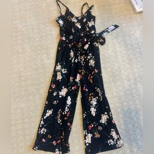 Black romper with colorful flowers